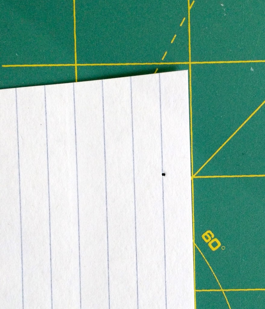 This is what it looked like after I dropped my needle. Note that the hole is a hair or two to the right of the line, which is what makes a "scant" 1/4".